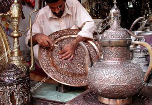 Mandatory Credit: Photo by Arshad Arbab/EPA/Shutterstock (7866679c)
A Craftsman Works On a Handicraft Made Up of Copper in Peshawar Pakistan 20 August 2007 Pakistan Exports Marble Wood Carpet Mirror and Glass Shoes Embroidery Metal and Clay Pots and Many Other Miscellaneous Handmade Items to Usa Europe Middle East and Far East
Pakistan Handicrafts - Aug 2007